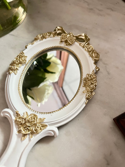 Vintage style rosette hand held vanity mirror