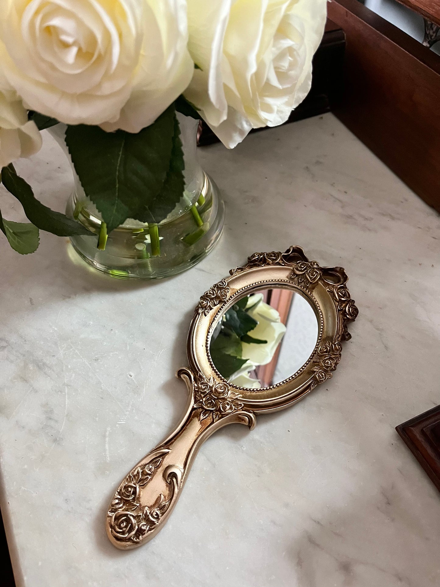 Vintage style rosette hand held vanity mirror