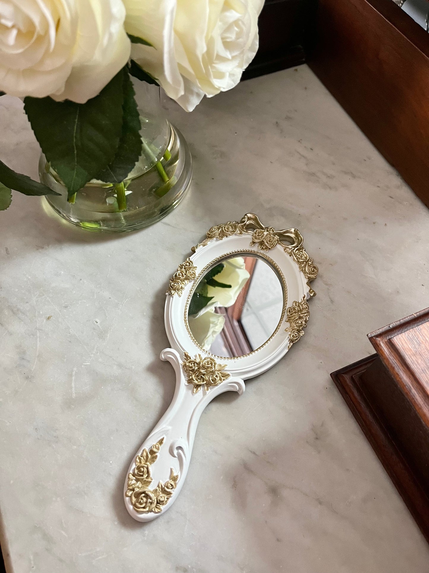 Vintage style rosette hand held vanity mirror