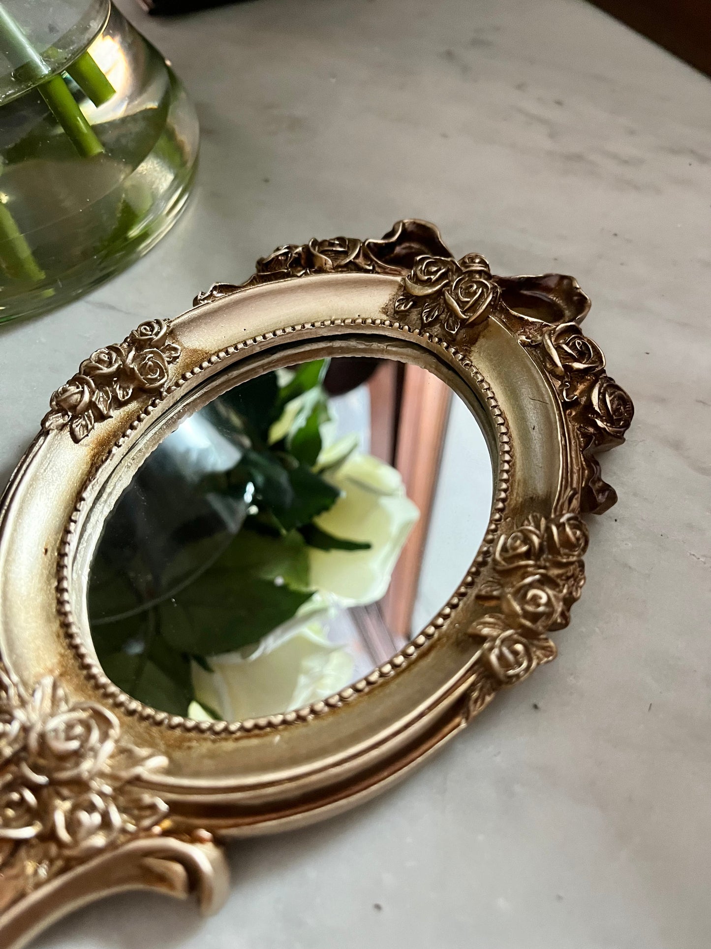 Vintage style rosette hand held vanity mirror